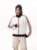 Jaqueta listrada com blocos de cor e gola alta estilo casual americano para homens e mulheres, roupa de casal, casaco esportivo de corte solto para primavera e outono, estilo casual