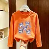 Camiseta de manga comprida para meninas, nova e estilosa para o outono de 2026, top infantil único e super fofo, camiseta básica de algodão puro com gola redonda