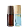 Botella de roll-on de color con tapa botella de aceite esencial 10 ml sub-botella de perfume tapa con veta de madera botella de vidrio transparente esmerilado venta al por mayor