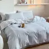 Juego de ropa de cama de algodón 100% de grado A para maternidad e infantil, juego de cuatro piezas de algodón puro con un diseño de dos tonos simple y de alta gama, que incluye funda de edredón, sábana plana y sábana bajera