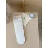 Calcetines de otoño 2026 para mujer, estilo coreano, de celebridad de internet, color liso, borde con volantes, algodón acanalado de doble aguja, calcetines de media pantorrilla, calcetines apilables