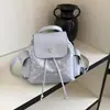 Mochila Fofa Estilo Universitário Coreano 2026 Verão Nova Mochila Pequena para o Dia a Dia Portátil Nicho Bolsa de Mão com Bolinhas