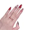2026 Dança do Leão Cereja Vermelha Gatinho Olho de Gato Outono/Inverno Novo Estilo Elegante Clareador Arte de Unhas Feita à Mão Pontas de Unha Atacado