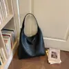 Bolso de mujer de gran capacidad, nuevo modelo de verano 2026, bolso de hombro tejido de lujo ligero vintage de alta gama, bolso tote para el trabajo