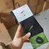 Meias Suwan Nexter mesmo estilo costura meias esportivas da moda comprimento médio sola de toalha masculina e feminina novas meias esportivas