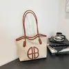 Bolsa Tote de Ombro/Axila Grande Capacidade 2026 Nova Tendência Europeia e Americana com Letras Personalizada Fashionável Elegante para Mulheres