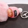 Llavero de muñeca linda durmiendo, lindo colgante de bola de pelo de bebé de dibujos animados, llavero de coche, adornos para bolsa, venta al por mayor