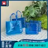 Bolsa de mano transparente para ropa al por mayor bolsa de PVC de alta gama bolsa de plástico portátil logo personalizado para llevar en la mano bolsa de regalo de mano