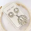 Nuevo especial transfronterizo explosión de tendencia europea y americana titanio acero alta calidad color collar pendientes traje femenino joyería de concha real