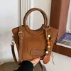 Moda Transfronteriza Estilo Coreano Simple Súper Caliente 2026 Bolso Nuevo Bolso de Mujer Versátil para el Trabajo Bolso de Hombro Cruzado Bolso Tipo Cubo
