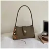 Bolso pequeño cuadrado de color sólido retro de alto valor para mujer, nuevo estilo de otoño 2026, bolso de mano de hombro moderno y elegante