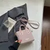 Bolso bandolera de un solo hombro casual elegante de nicho Shuai Mi Jia, moderno bolso cubo para mujer nuevo de verano 2026