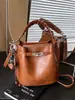 Bolso de Mano Versátil Estilo Coreano Transfronterizo Bolso Cubo para Mujer 2025 Primavera Nuevo de Moda Retro Sensación de Alta Gama Bolso de Hombro Único Cruzado
