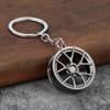 Llavero de metal creativo turbo engranaje buje disco de freno amortiguador pinza colgante llavero de coche al por mayor