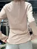 Camiseta negra de manga larga con protección solar estilo coreano para mujer, diseñada para primavera y otoño, corte ajustado, ligera y favorecedora como prenda exterior