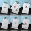 Etiqueta de cartão de algodão branco papel especial customizada papel com grão bonito bronzagem gravação textura textura logo de roupa de alta qualidade etiqueta pendurada