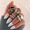 Venta caliente transfronteriza europea y americana anillo de amor de melocotón negro con circonita y esmalte negro retro para mujer juego de 7 anillos