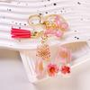 Nueva Letra Colgante de Flor Seca Margarita Rosa Regalos Borla de Mariposa Colgante Accesorios Simples Llavero de Gota de Pegamento