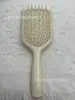 Suministro Directo de Fábrica Peine Masajeador Hueco Color Macarrón Malla Hueca Fácil de Limpiar Dientes Redondeados Masajea el Cuero Cabelludo