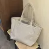 Bolsa de lona listrada estilo coreano de alto valor para mulheres 2025 nova de grande capacidade portátil para carregar na mão bolsa tote para o dia a dia bolsa de compras