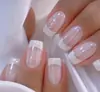 Modelo Más Vendido de Comercio Exterior: Uñas Postizas Rectangulares de Presión de Longitud Media, Color Rosa Dulce Nude con Borde Blanco Clásico, Perla, Paquete de 24 Piezas, Venta al por Mayor