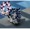 Broche Bauhinia de AliExpress más vendido Temperamento femenino de alta gama Pin antiluz Diamante Trigo Corsage Accesorios para traje