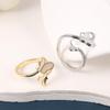 Anillo de pareja al por mayor, joyería ligera de lujo de alta gama para mujer, anillo de boca suelta asimétrico sin color para hombre, combina con todo.