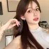 Nuevos pendientes de botón de moda exquisitos para mujer, aguja de plata 925, estrella de cuatro puntas, diseño de nicho, clip para oreja de diamante, venta al por mayor