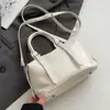 Corea del Sur Moda Tendencia Estilo Crema Simple Portátil Bolso Almohada de Cuero Suave Moda Femenina Versátil Casual para Viaje Bolso Cruzado