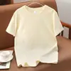 Camiseta de Algodão Puro com Manga Curta e Ombro Regular para Homens e Mulheres, Novo Estilo Verão 2026, Tamanho Grande Versátil com Gola Redonda e Manga Curta, Atacado