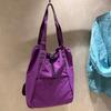 Mismo Estilo para Hombres y Mujeres 2025 Nuevo Bolso Deportivo de Hombro de Nailon para Axila Hombro Único Impermeable Ropa de Trabajo Deportiva Bolsa para Almacenamiento con Cuerda