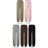 Conjunto de tres piezas para mujer en otoño: top de tirantes a rayas bicolor + camiseta de blusa holgada de manga larga con cuello en V + pantalones de campana de cintura alta
