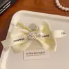 Horquilla de camelia con lazo de lujo ligero estilo francés, pinza de bola exquisita, clip para coleta de viento pequeño y fragante, para recogidos