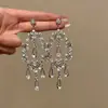 Brincos leves de luxo elegantes com gotas d'água vazadas, brincos de diamante estilo asiático Simi para mulheres, vestido de noiva, brincos de borla exagerados
