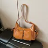 Bolso de axila de nicho coreano para mujer 2024 Nuevo Vintage Simple de alta gama Bolso cruzado Dulce Fresco Bolso de motociclista