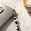 Nuevo accesorio para teléfono TEMU estilo coreano, suave, con lazo de perlas, correa para teléfono transfronteriza, estilo ins
