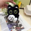 Novo Pingente de Bolsa de Casal Gato Preto de Pelúcia Olhos Grandes Segurando Peixe Boneca Super Fofa Chaveiro Pingente de Mochila Venda por Atacado