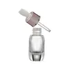Botella cuentagotas de fondo grueso de 30 ml en color oro rosa para aceites esenciales, material de empaque cosmético de alta gama, disponible para venta al por mayor