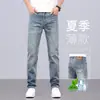 Jeans masculinos de alta qualidade 2026 novos calças casuais de verão masculinas azul claro slim reto verão calças finas moda masculina