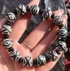 Suministro directo de fábrica de pulsera de cuentas de pulpa desgastada con patrón de herradura de Xizang nuevo 14 mm 'mB productos