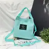 Atacado Primavera e Verão Nova Mochila de Lona Feminina Bolsa de Mão Bolsa Transversal de Ombro Cor Doce Porta-moedas para Celular