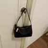Nuevo bolso de axila de nicho 2026, bolso tipo almohada minimalista y elegante, bolso de hombro versátil, bolso cruzado simple, moderno