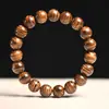 Pau-rosa amarelo sul-americano com padrão de paisagem dourada Pele de tigre Sândalo 10mm Pulseira de madeira pequena Peça de mão