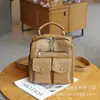 Bolsa casual Mukari de couro com múltiplos bolsos 2025 nova versátil moda multifuncional ombro duplo transversal pele de ovelha