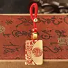 Chaveiro auspicioso de paz em latão puro com envelope de paz em óleo vermelho, cordão de chave trançado à mão, pingente para chave de carro
