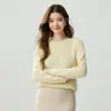 Suéter feminino de cashmere puro com recortes em formato de pêssego, gola redonda, camada interna quente, design vazado, casual, versátil, elegante e adequado como camada base ou peça de tricô