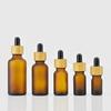 Botella de aceite esencial de madera de bambú de 10 ml, anillo marrón esmerilado, gotero de cabeza de plástico, subbotella, tapa de madera de bambú, botella pequeña portátil para muestras cosméticas