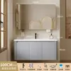 Tocador de baño engrosado y ahorrador de espacio con diseño en color crema, que cuenta con un lavabo redondeado, lavabo cerámico integrado y un lavabo de una sola pieza.