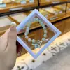 Libro Caperucita Roja Mismo Estilo Estudiante Pulsera de Glaseado de Palomitas de Maíz Hecha a Mano con Cuentas Dibujos Animados Cristal Pulsera Infantil Venta al por Mayor Cajas de Regalo