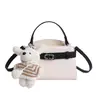 Elegante y simple bolso Kelly, bolso de hombro y bandolera versátil con bloques de color, nuevo bolso de mano cuadrado pequeño estilo coreano de lujo ligero 2026